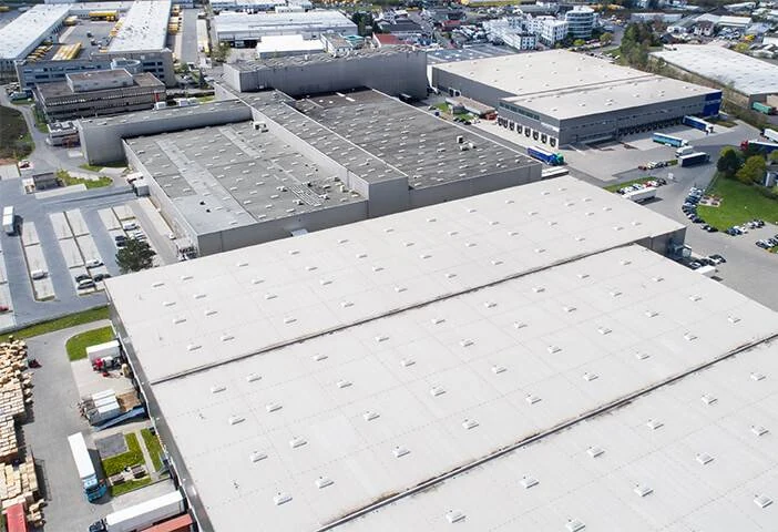 Aerial view of commercial buildings with flat roofs